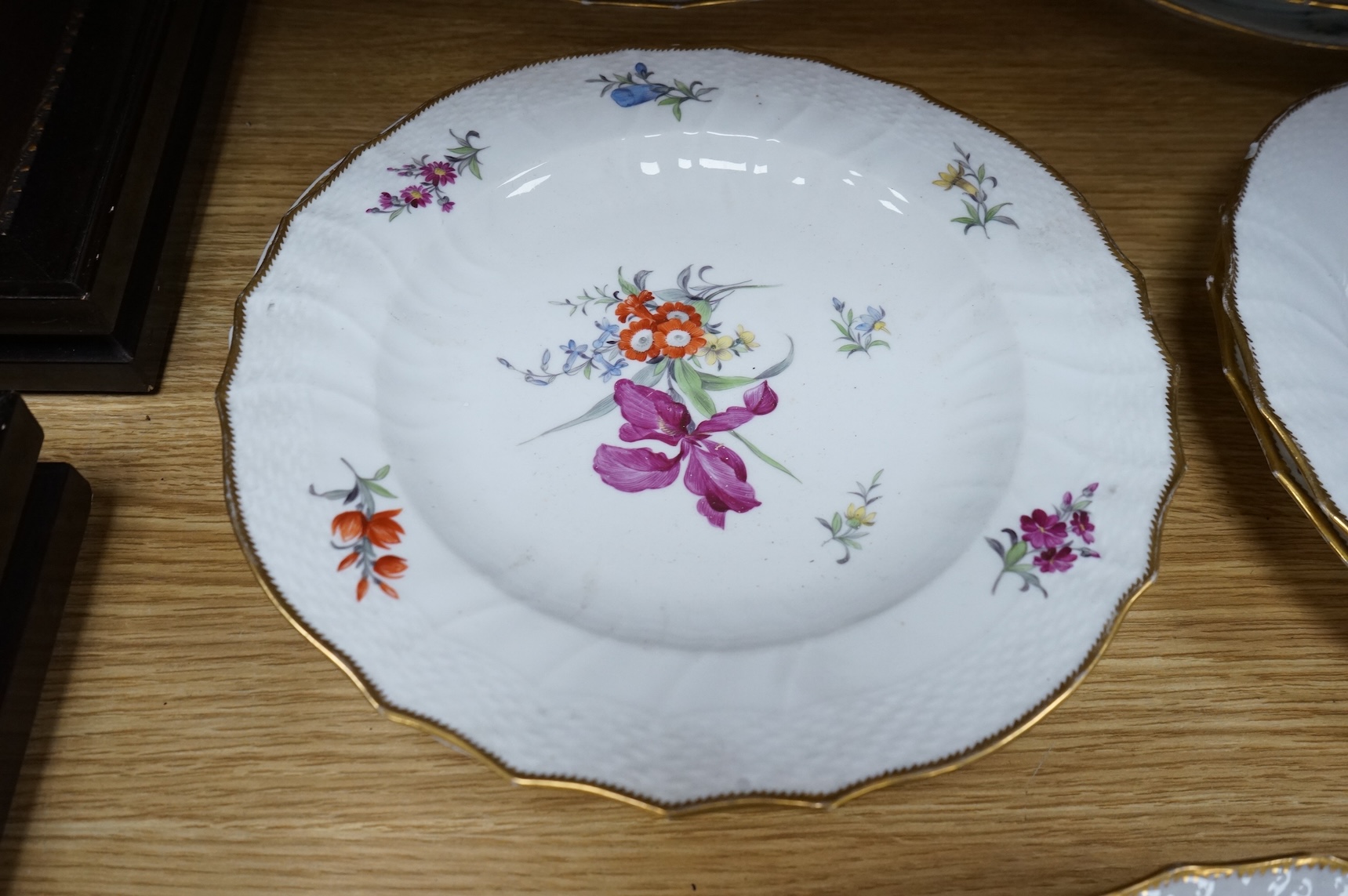 Ten 19th century Copenhagen floral porcelain plates, 23cm in diameter
